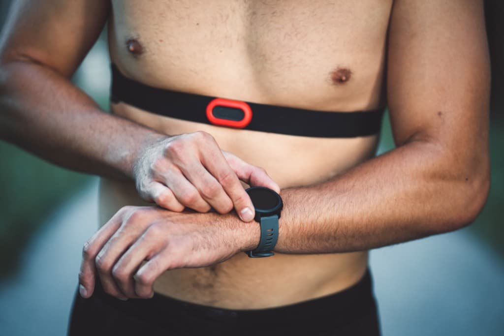 Athlete with chest strap heart rate monitor